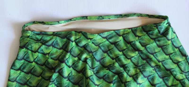 fold top of swimsuit to inside