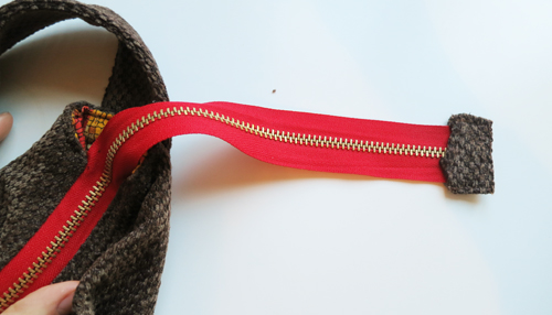long zipper tail on presidio purse zipped